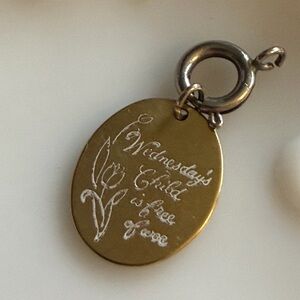Vintage etched "Wednesday's child is free of woe" pendant